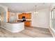 Open kitchen with stainless appliances, a center island with seating, and light wood cabinetry at 3036 Landing Falls Ln, Raleigh, NC 27616