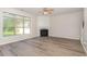 Cozy living room with gas fireplace, bright windows and new hard surface floors at 3036 Landing Falls Ln, Raleigh, NC 27616