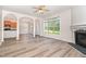 Spacious living room with fireplace and open concept to kitchen with bright natural light at 3036 Landing Falls Ln, Raleigh, NC 27616
