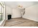 Cozy living room with gas fireplace, bright windows and new hard surface floors at 3036 Landing Falls Ln, Raleigh, NC 27616