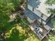 Aerial view of home with a large deck, well maintained yard and detached garage at 304 Polk St, Raleigh, NC 27604