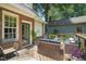The back deck features outdoor seating with a fire pit table and a beautiful brick home at 304 Polk St, Raleigh, NC 27604