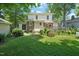 Spacious backyard boasts a lovely wooden deck, mature trees, and lush green grass at 304 Polk St, Raleigh, NC 27604
