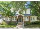 Charming two-story brick home with landscaped front yard and inviting entryway at 304 Polk St, Raleigh, NC 27604