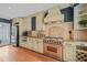 Modern kitchen features stainless steel appliances, tile backsplash, and wood floors at 304 Polk St, Raleigh, NC 27604