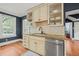 Kitchen features stainless steel dishwasher, granite countertops, and glass door cabinets at 304 Polk St, Raleigh, NC 27604