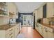 Open kitchen featuring stainless steel appliances, granite counters, and exterior access at 304 Polk St, Raleigh, NC 27604