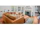 Open-concept living room with fireplace and large sectional at 304 Polk St, Raleigh, NC 27604