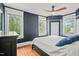 This spacious main bedroom features hardwood floors, a ceiling fan, and lots of natural light at 304 Polk St, Raleigh, NC 27604