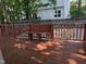 Backyard view of the wood deck with a bench overlooking the backyard at 3109 Benton Cir, Raleigh, NC 27615