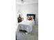 Bedroom features a twin bed, a nightstand with a lamp, and neutral walls at 3109 Benton Cir, Raleigh, NC 27615