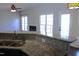 Kitchen island countertop with stainless steel sink and view of living room fireplace at 3109 Benton Cir, Raleigh, NC 27615