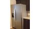 Stainless steel refrigerator with water dispenser complements the kitchen's granite countertops at 3109 Benton Cir, Raleigh, NC 27615