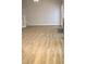 Open living space with hardwood floors, a fireplace, and stairs at 3109 Benton Cir, Raleigh, NC 27615