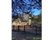 Community playground featuring slides, climbing structures, and a fenced area at 3109 Benton Cir, Raleigh, NC 27615