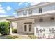 Rear exterior view of a white townhouse with a covered patio and exterior utilities at 3147 Rapid Falls Rd, Cary, NC 27519
