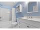 Bathroom features a shower-tub combo with a white vanity at 3147 Rapid Falls Rd, Cary, NC 27519