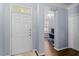 Entryway showcasing a white door and an office space, creating a welcoming entrance at 3147 Rapid Falls Rd, Cary, NC 27519