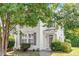 Charming townhouse with white siding, neat landscaping, and a welcoming front entrance with a brick walkway at 3147 Rapid Falls Rd, Cary, NC 27519