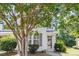 Charming townhouse with white siding, neat landscaping, and a welcoming front entrance with a brick walkway at 3147 Rapid Falls Rd, Cary, NC 27519