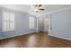 Inviting living room with hardwood floors, plantation shutters, and a welcoming atmosphere at 3147 Rapid Falls Rd, Cary, NC 27519