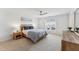 Bright bedroom with wood furniture, neutral carpet, and a ceiling fan at 3194 Retama Run, New Hill, NC 27562