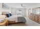 Bright bedroom with wood furniture, neutral carpet, and a ceiling fan at 3194 Retama Run, New Hill, NC 27562