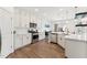 Bright and airy kitchen with modern stainless steel appliances and quartz countertops at 3194 Retama Run, New Hill, NC 27562