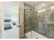 Modern bathroom with tile shower and glass door, viewed from the bedroom at 3194 Retama Run, New Hill, NC 27562
