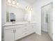 Bathroom with dual sinks and modern lighting at 321 Conrad Ln, Wake Forest, NC 27587