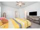 Comfortable bedroom with a ceiling fan, dresser, and ensuite at 321 Conrad Ln, Wake Forest, NC 27587