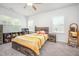 Spacious bedroom features a ceiling fan and two windows at 321 Conrad Ln, Wake Forest, NC 27587