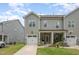 Attractive townhome featuring a covered porch, attached garage, and well-maintained landscaping at 321 Conrad Ln, Wake Forest, NC 27587