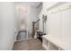 Bright foyer with wood floors, a coat rack, and easy access to the staircase at 321 Conrad Ln, Wake Forest, NC 27587