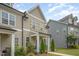 Well-maintained townhouse exterior with manicured landscaping and a welcoming entrance at 321 Conrad Ln, Wake Forest, NC 27587