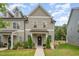 Charming two-story townhouse with a well-manicured lawn and inviting front porch at 321 Conrad Ln, Wake Forest, NC 27587