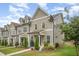 Attractive townhouses with tidy front yards and inviting entryways, creating curb appeal at 321 Conrad Ln, Wake Forest, NC 27587