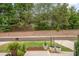 Well-maintained front yard features green grass, potted plants, and tidy landscaping at 321 Conrad Ln, Wake Forest, NC 27587