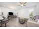 Bright and open living area with modern furnishings, hardwood floors, and plenty of light at 321 Conrad Ln, Wake Forest, NC 27587
