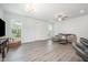 Open living room with hardwood floors, ample natural light, and modern decor at 321 Conrad Ln, Wake Forest, NC 27587