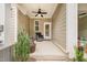 Cozy covered patio with a ceiling fan and comfortable seating area, perfect for relaxing outdoors at 321 Conrad Ln, Wake Forest, NC 27587