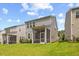 Lush green backyard with screened-in porch offers an ideal space for relaxation and enjoying the outdoors at 3224 Star Gazing Ln, Durham, NC 27703