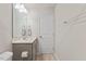 Cozy bathroom features a gray vanity and large mirror at 3224 Star Gazing Ln, Durham, NC 27703
