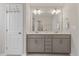 Bathroom boasts double sink vanity, tile floors, and great mirror at 3224 Star Gazing Ln, Durham, NC 27703