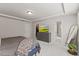 Comfortable bedroom features tray ceiling, neutral walls, and TV atop gray dresser at 3224 Star Gazing Ln, Durham, NC 27703