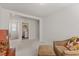 Bonus room with neutral carpet and chair and ottoman. Laundry room is located just off the bonus room at 3224 Star Gazing Ln, Durham, NC 27703