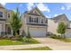 Charming two-story home featuring gray siding, black shutters, and a well-manicured lawn and landscaping at 3224 Star Gazing Ln, Durham, NC 27703