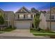 Charming two-story home featuring gray siding, black shutters, and a well-manicured lawn and landscaping at 3224 Star Gazing Ln, Durham, NC 27703