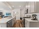 Kitchen featuring stainless steel appliances, an island, and an open layout at 3224 Star Gazing Ln, Durham, NC 27703