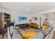 Comfortable living room with sectional sofa, display shelving and large-screen television at 3224 Star Gazing Ln, Durham, NC 27703